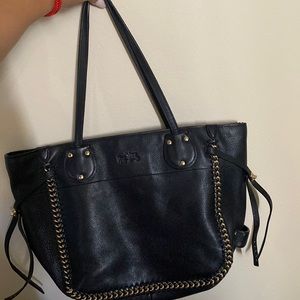 Black leather vintage coach bag with gold around and shoulder strap and zipper